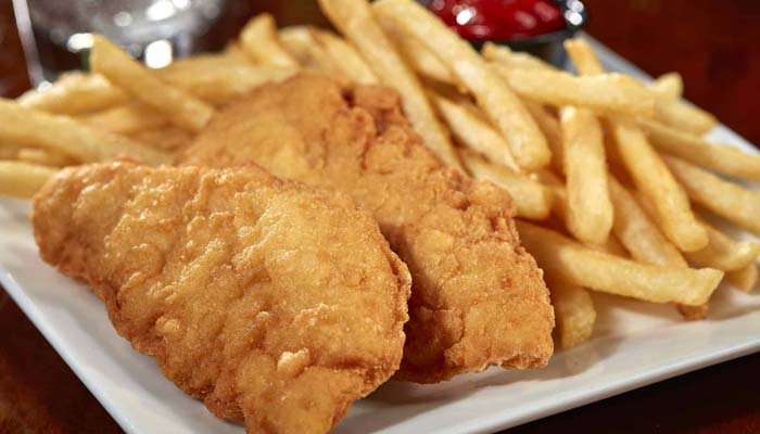 kids chicken tender and French fries basket served at Waverly Beach bar and grille restaurant in Fox Valley Menasha, WI